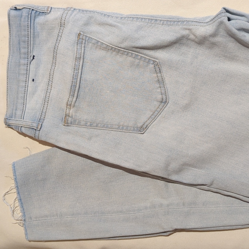 Raw edge acid wash jeans